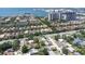 Breathtaking aerial view showcasing a waterfront community with stunning views of the bay and the city skyline in the distance at 4735 W Oklahoma Ave, Tampa, FL 33616