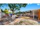 Spacious backyard with a brick patio, fire pit, pergola, and storage shed, offering a delightful outdoor living space at 4735 W Oklahoma Ave, Tampa, FL 33616