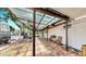 Spacious brick patio with a pergola, offering a great outdoor living and entertaining area, with room for seating and dining at 4735 W Oklahoma Ave, Tampa, FL 33616