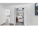 Open closet revealing organized shelves and storage solutions, enhancing space and convenience in the bedroom at 4735 W Oklahoma Ave, Tampa, FL 33616