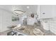 Bright kitchen features stainless steel appliances, granite countertops, modern lighting, and breakfast bar with seating at 4735 W Oklahoma Ave, Tampa, FL 33616