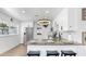 Bright kitchen features stainless steel appliances, granite countertops, modern lighting, and breakfast bar with seating at 4735 W Oklahoma Ave, Tampa, FL 33616