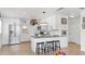 Bright kitchen features stainless steel appliances, granite countertops, modern lighting, and breakfast bar with seating at 4735 W Oklahoma Ave, Tampa, FL 33616