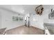 Bright kitchen features stainless steel appliances and light colored wood-look flooring at 4735 W Oklahoma Ave, Tampa, FL 33616