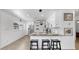 Bright kitchen features stainless steel appliances, granite countertops, modern lighting, and breakfast bar with seating at 4735 W Oklahoma Ave, Tampa, FL 33616