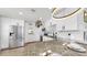 Bright kitchen features stainless steel appliances, granite countertops, modern lighting, and breakfast bar with seating at 4735 W Oklahoma Ave, Tampa, FL 33616