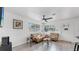 Inviting living room with lots of natural light, comfortable seating area, and wood-look tile flooring at 4735 W Oklahoma Ave, Tampa, FL 33616