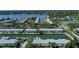 Aerial view of waterfront condos with private boat docks and community parking lot at 5075 Starfish Se Dr # A, St Petersburg, FL 33705