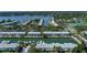 Scenic aerial view showcases waterfront homes with boat docks along a canal, surrounded by lush greenery at 5075 Starfish Se Dr # A, St Petersburg, FL 33705