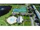 Overhead view of community pool, tennis courts, and lovely landscaping at 5075 Starfish Se Dr # A, St Petersburg, FL 33705