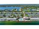 Beautiful aerial view of waterfront condos with a community pool, dock, and tennis courts at 5075 Starfish Se Dr # A, St Petersburg, FL 33705