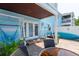 Back patio featuring brick pavers, cozy hammocks, and outdoor seating at 5075 Starfish Se Dr # A, St Petersburg, FL 33705