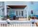 Charming patio with brick pavers, hanging hammocks, and outdoor seating area at 5075 Starfish Se Dr # A, St Petersburg, FL 33705