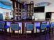 Community bar with ample seating, well-stocked shelving, and televisions for entertainment at 5075 Starfish Se Dr # A, St Petersburg, FL 33705