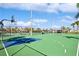 Community basketball court featuring well-maintained greenspace, basketball hoop and pole at 5075 Starfish Se Dr # A, St Petersburg, FL 33705