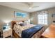 Comfortable bedroom showcasing a ceiling fan, closet and a view from the window at 5075 Starfish Se Dr # A, St Petersburg, FL 33705