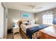 Comfortable bedroom showcasing a ceiling fan, closet and a view from the window at 5075 Starfish Se Dr # A, St Petersburg, FL 33705