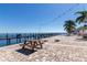 Dock with a picnic table on a brick patio with waterfront access in a beautiful community at 5075 Starfish Se Dr # A, St Petersburg, FL 33705