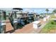 Dock view featuring boat slip with a boat and storage boxes in a waterfront community at 5075 Starfish Se Dr # A, St Petersburg, FL 33705