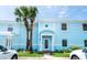 Charming light blue two-story condo with white trim, palm trees, and well-kept landscaping at 5075 Starfish Se Dr # A, St Petersburg, FL 33705