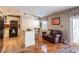 Open concept kitchen with black appliances, kitchen island and an eat-in space at 5075 Starfish Se Dr # A, St Petersburg, FL 33705