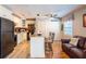 Eat-in kitchen with granite island, black appliances and a ceiling fan at 5075 Starfish Se Dr # A, St Petersburg, FL 33705