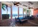 A lovely outdoor seating area with brick flooring overlooking the water and community dock at 5075 Starfish Se Dr # A, St Petersburg, FL 33705