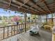 Spacious covered back porch featuring a bench and room for plants at 544 80Th N Ave, St Petersburg, FL 33702