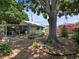 Spacious backyard with lush garden, mature trees offering a private outdoor space at 544 80Th N Ave, St Petersburg, FL 33702