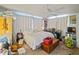 Bright bedroom with neutral walls, ceiling fan, and hardwood floors at 544 80Th N Ave, St Petersburg, FL 33702