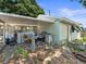 Carport features a concrete statue and a covered area with lots of storage opportunities at 544 80Th N Ave, St Petersburg, FL 33702