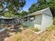 A single-story home featuring an awning, and well-maintained yard at 544 80Th N Ave, St Petersburg, FL 33702