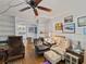 Inviting living room with natural light, built-in shelving, and hardwood floors at 544 80Th N Ave, St Petersburg, FL 33702