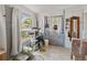 Mud room with a cat tree, door to the backyard, neutral colors, and ceramic tile flooring at 544 80Th N Ave, St Petersburg, FL 33702