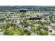 Aerial view showing the community center, shuffleboard, golf course and surrounding green spaces at 5456 Fairway Bend Dr, Sarasota, FL 34243