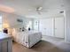 Well-lit bedroom with a beach theme that includes a ceiling fan and large closet at 5456 Fairway Bend Dr, Sarasota, FL 34243