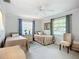 Inviting bedroom features two twin beds, a center nightstand, and a chair, creating a peaceful and functional space at 5456 Fairway Bend Dr, Sarasota, FL 34243