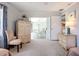 Cozy bedroom showcasing wicker furniture, light walls and bedroom access, creating a tranquil and inviting atmosphere at 5456 Fairway Bend Dr, Sarasota, FL 34243