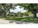 Community pool area showcasing mature landscaping and a refreshing space for relaxation at 5456 Fairway Bend Dr, Sarasota, FL 34243