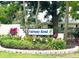 Attractive community sign for Fairway Bend set amidst lush landscaping and mature trees at 5456 Fairway Bend Dr, Sarasota, FL 34243