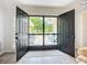 Inviting entryway with double doors leading to a private patio at 5456 Fairway Bend Dr, Sarasota, FL 34243