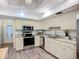 Well-equipped kitchen with stainless steel appliances, granite countertops, and ample cabinet space at 5456 Fairway Bend Dr, Sarasota, FL 34243