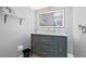 Bathroom with modern vanity, illuminated mirror, and stylish gray paint at 5734 20Th N Ave, St Petersburg, FL 33710