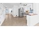 Bright, open kitchen features stainless steel appliances, white cabinetry, and a breakfast bar at 5734 20Th N Ave, St Petersburg, FL 33710