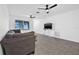 Bright and airy living room featuring tile floors, ceiling fans, and a comfortable seating arrangement at 5734 20Th N Ave, St Petersburg, FL 33710