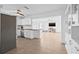 Bright open kitchen with stainless appliances leading to spacious living area with tile flooring at 5734 20Th N Ave, St Petersburg, FL 33710