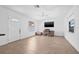 Bright living area with tile floors, a ceiling fan, and a well-lit workspace with a large-screen monitor at 5734 20Th N Ave, St Petersburg, FL 33710