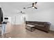 Bright and airy living room featuring tile floors, ceiling fans, and a comfortable seating arrangement at 5734 20Th N Ave, St Petersburg, FL 33710
