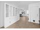 Bright living area with built-in glass cabinetry and tile flooring that flows throughout the home at 5734 20Th N Ave, St Petersburg, FL 33710