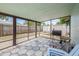 Screened patio with seating, grill, and unique tile flooring offering the perfect outdoor space at 5734 20Th N Ave, St Petersburg, FL 33710